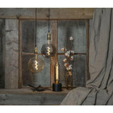 Dekorative, dimmbare LED Leuchte im industrial Design mit Smokey-Glas.