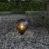 Dekorative runde Gartenleuchte mit Smokey-Glas und einer E27 Fassung.